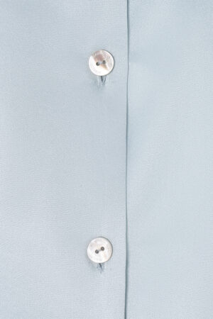 MANITO Jolly Women's Silk Pajamas Set close-up of pearl button with engraved logo.