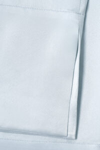 MANITO Jolly Women's Silk Pajamas Set pocket stitching detail on glossy silk fabric.