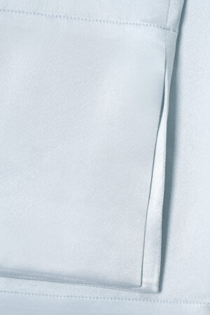 MANITO Jolly Women's Silk Pajamas Set pocket stitching detail on glossy silk fabric.