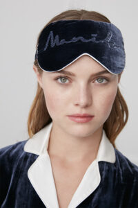 A model wearing Medieval Blue Ladylike Silk Velvet Eye Mask, featuring embroidered "MANITO" branding.