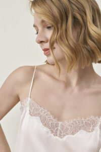 Close-up of ivory MANITO Latica Lace Silk Camisole Top highlighting lace neckline.