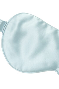 Close-up of Light Eye Mask in blue silk satin, highlighting smooth texture and delicate stitching.