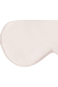 Detail shot of Light Eye Mask in pink silk, emphasizing soft padding and seamless finish.