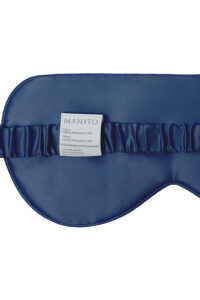Back view of navy Light Eye Mask with ruched silk strap and product care label.