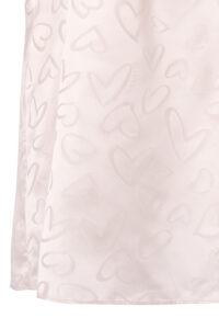Hem detail of MANITO Loving Silk Nightdress showing subtle woven heart patterns and delicate fabric sheen.