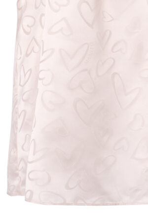 Hem detail of MANITO Loving Silk Nightdress showing subtle woven heart patterns and delicate fabric sheen.