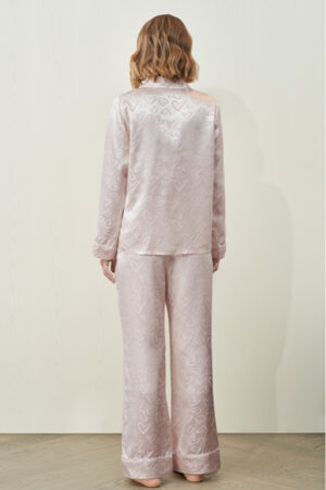 Back view of the full MANITO Loving Women's Pajama Set worn by a model, highlighting the soft drape and romantic design.