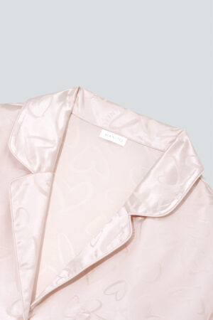 Close-up of the collar on MANITO Loving Women's Pajama Set, showcasing smooth silk texture and subtle jacquard hearts.