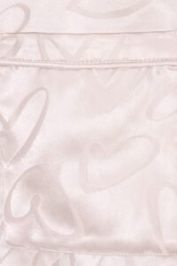 Pocket detail of MANITO Loving Women's Pajama Set with jacquard heart motifs, blending function and elegance.