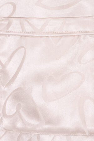 Pocket detail of MANITO Loving Women's Pajama Set with jacquard heart motifs, blending function and elegance.