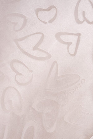 Heart pattern with MANITO logo woven into the fabric of the Loving Women's Pajama Set, created using jacquard technique.