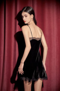 Back view of model showcasing MANITO Luella Silk Velvet Black Nightdress with delicate lace details.