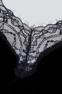 Close-up detail of delicate lace trim on MANITO Luella Silk Velvet Black Nightdress, highlighting intricate craftsmanship.