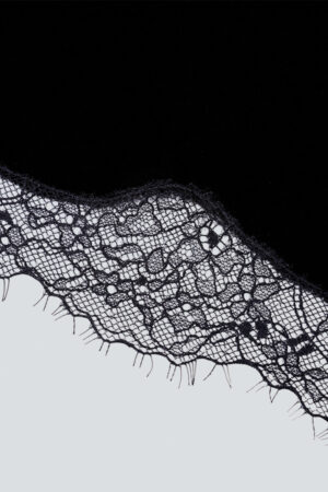 Detailed shot of MANITO Luella Silk Velvet Black Nightdress's hemline, highlighting the fine craftsmanship and luxurious fabric.