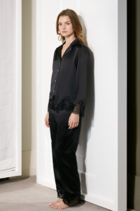 Side-view of Luella Women's Pajama Set in black silk, showcasing full-length pants and fine lace hems.