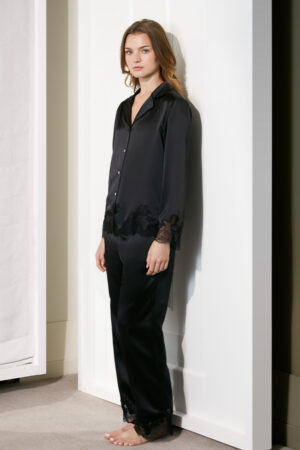 Side-view of Luella Women's Pajama Set in black silk, showcasing full-length pants and fine lace hems.