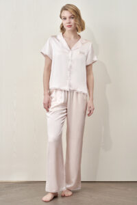 MANITO Lunavie Women's Silk Short Sleeve Pajama Set in soft pink, featuring glossy silk top and full-length pants.