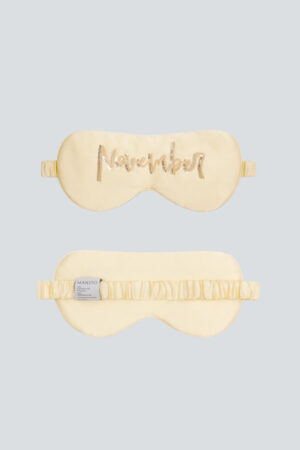 Yellow November Lune Silk Eye Mask with soft silk fabric and golden sequin embroidery.