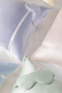 Macaron Silk Pillowcase & Eye Mask Set in assorted pastel colors displayed together for a soft, elegant travel-ready look.