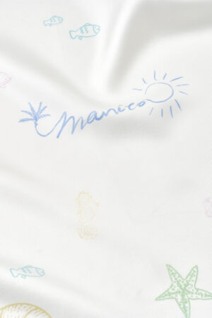 Detailed view of MANITO Ocean Wave Silk Scarf with brand signature, sun symbol, and marine elements.