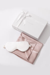 Sweet Dreams Silk Pillowcase & Eye Mask Set with pink silk pillowcase, white silk eye mask, and MANITO gift box.