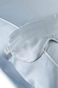 Sweet Dreams Silk Pillowcase & Eye Mask Set in light blue with a matching silk eye mask and bordered pillowcase.