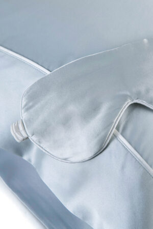Sweet Dreams Silk Pillowcase & Eye Mask Set in light blue with a matching silk eye mask and bordered pillowcase.