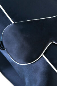 Sweet Dreams Silk Pillowcase & Eye Mask Set in navy blue showing the silk eye mask and bordered pillowcase.