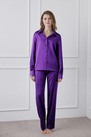 Vibrant Silk Shirt in purple worn by model, highlighting its glossy silk texture.