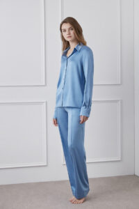 Model posing in a sky blue Vibrant Silk Shirt, giving a look of effortless elegance.