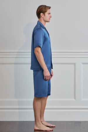 Side view of model wearing MANITO Sketchy Men's Silk Pajama Set in blue.