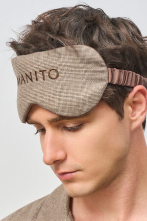 Side view of a man in Maple Men's Eye Mask, eyes lowered in a quiet, restful moment.