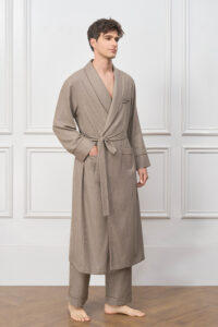Model wearing the Maple Men's Long Robe, showcasing the earthy brown tone, textured check weave, and relaxed shawl-collar silhouette.