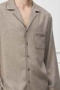 Detail of Maple Men's Pajama Set shirt front, highlighting buttons, piping, and fine woven check pattern.
