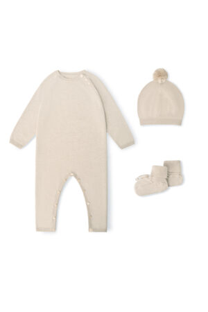 Mellow Baby's Knit Onesie Set in sand-camel, with long-sleeve onesie, pompom hat, and socks arranged on a white background.