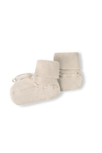 Mellow Baby's knit socks in sand-camel, featuring soft cuffs and ties to keep a baby's feet cozy.