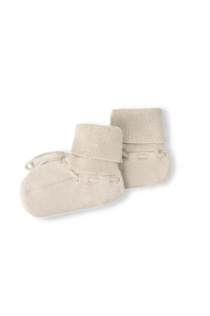 Mellow Baby's knit socks in sand-camel, featuring soft cuffs and ties to keep a baby's feet cozy.