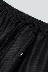 Drawstring waistband of Monogram Cotton Silk Hoodie pants in black with fine vertical texture.