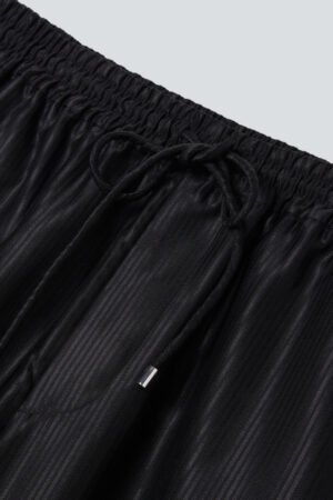 Drawstring waistband of Monogram Cotton Silk Hoodie pants in black with fine vertical texture.