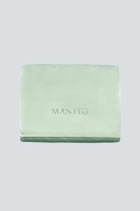 The 22 Silk Pillow Sham Set in soft green, highlighting luxurious comfort and refined style.
