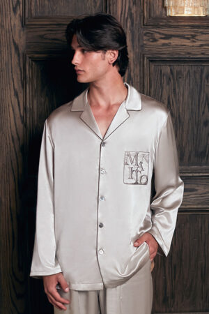 Model sitting in MANITO Neat Men's Lounge Set, styled casually to highlight comfort and luxury at home.