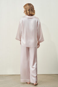 MANITO new authentic women's polo shirt pajama set modeled by a person in a relaxed, casual pose from a back angle.