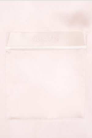 Detail shot of the polo shirt patch pocket from MANITO new authentic women's polo shirt pajama set in a ballet pink color.