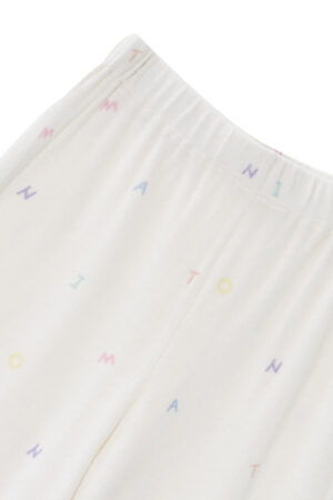 New Signature Children's Knit Pajama pants, highlighting the elastic waistband and all-over rainbow lettering on the plush white fabric.