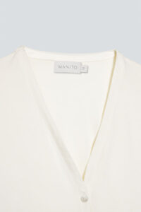 Close-up of New Soft white camisole set's V-neckline and delicate button details.