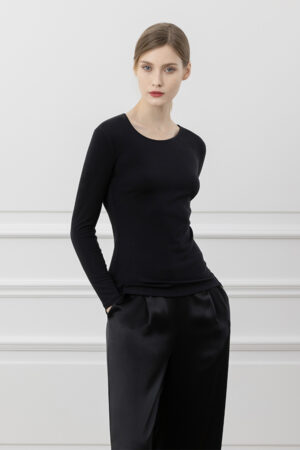 Side profile of Newsoft Women's Modal Knit T-Shirt in black, highlighting the soft fabric and elegant waist contour.