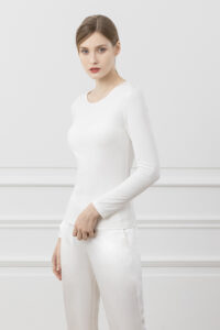 Newsoft Women's Modal Knit T-Shirt in white, showing side angle with a naturally contoured shape and soft drape.