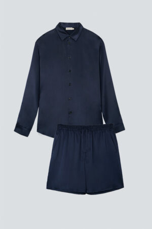 Flat lay of MANITO Ocean Blue Dolphin Men's Pajama Set including shirt and shorts.