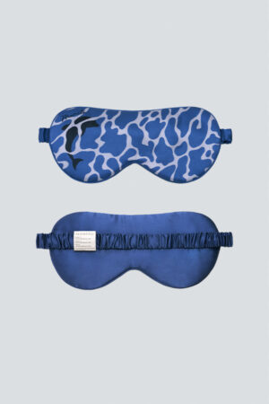 Front and back view of MANITO Ocean Blue Dolphin Silk Eye Mask showing dolphin pattern and silk strap.