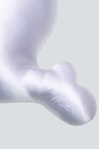 Close-up of MANITO Ocean Blue Kid's Pillow in manta shape, emphasizing craftsmanship.